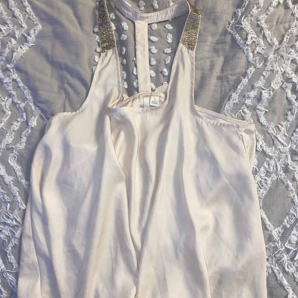 Silk blouse with rhinestone detail.